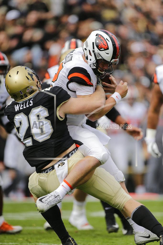 Jack Dempsey Colorado linebacker Carson Wells (26) sacks Oregon State quarterback Jack Colletto (12) during the first half of an NCAA college football game, Saturday, Oct. 27, 2018, in Boulder, Colo. (AP Photo/Jack Dempsey)