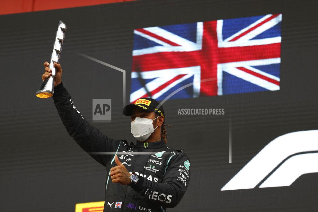 Bryn Lennon Second placed Mercedes Lewis Hamilton celebrates on the podium at the end of the Emilia Romagna Formula One Grand Prix, at the Imola racetrack, Italy, Sunday, April 18, 2021. (Bryn Lennon/ Pool Via AP)