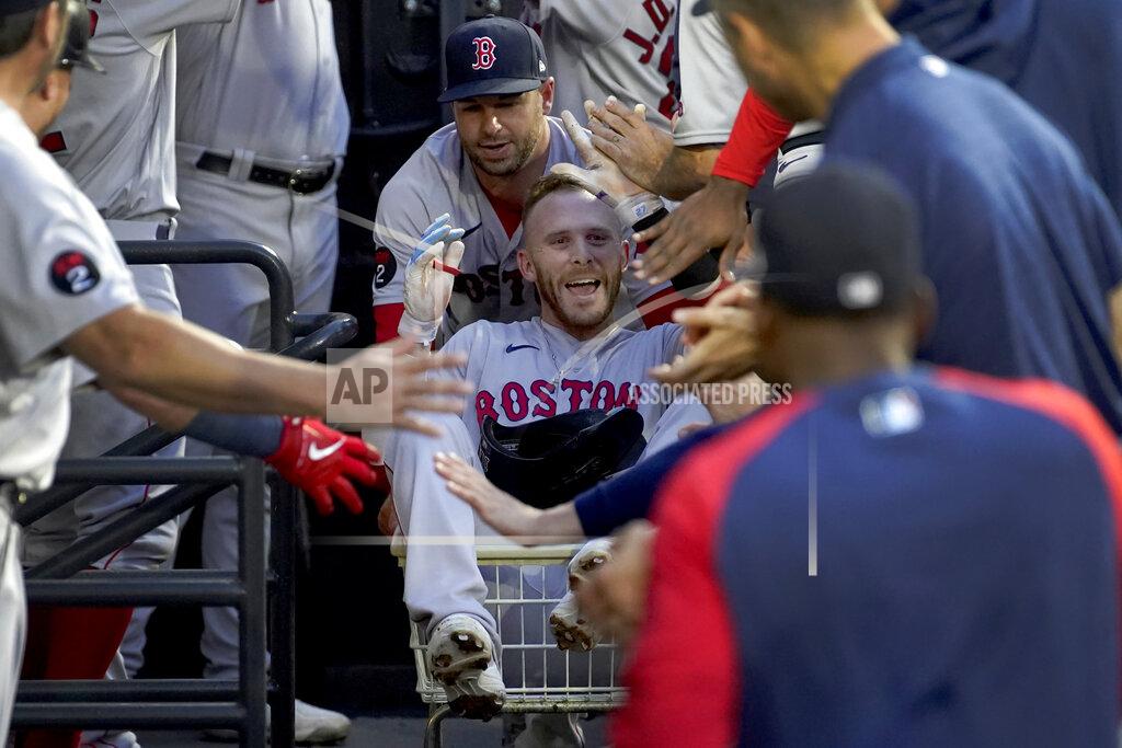 Charles Rex Arbogast Boston Red Sox's Trevor Story celebrates in the dugout his home run off Chicago White Sox starting pitcher Dallas Keuchel during the second inning of a baseball game Thursday, May 26, 2022, in Chicago. (AP Photo/Charles Rex Arbogast)