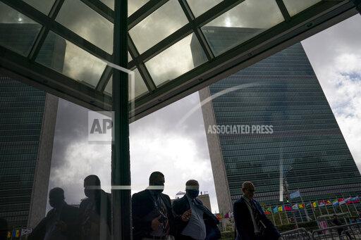 Pedestrians pass along the United Nations headquarters, Wednesday, Sept. 22, 2021, during the 76th Session of the U.N. General Assembly in New York.. (AP Photo/John Minchillo)