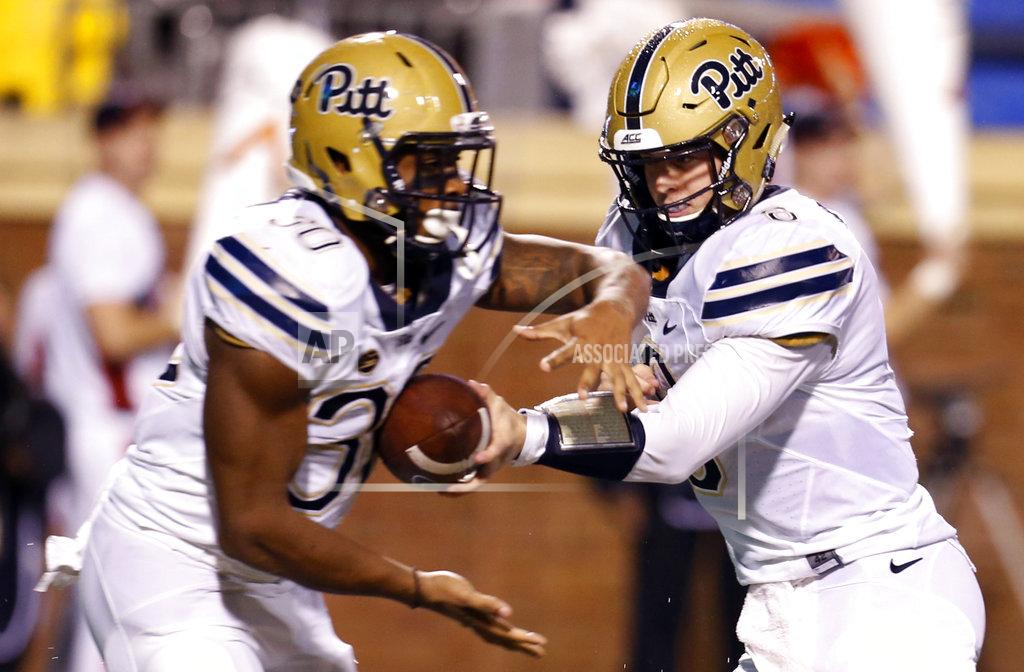 Steve Helber FILE - In this Nov. 2, 2018, file photo, Pittsburgh quarterback Kenny Pickett (8) hands off to running back Qadree Ollison (30) during the first half of an NCAA college football game against Virginia in Charlottesville, Va. Pickett doesn't take offense to the term "game manager." The sophomore is just fine if all he has to do is hand the ball off and watch the running game go to work, something he hopes to do frequently on Saturday when the Panthers play No. 2 Clemson in the ACC Championship. (AP Photo/Steve Helber)