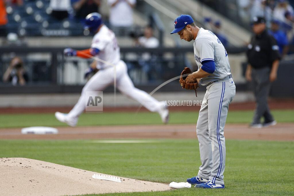 Adam Hunger Toronto Blue Jays pitcher Steven Matz stands near the mound after giving up a two-run home run to New York Mets' Pete Alonso during the first inning of a baseball game Friday, July 23, 2021, in New York. (AP Photo/Adam Hunger)
