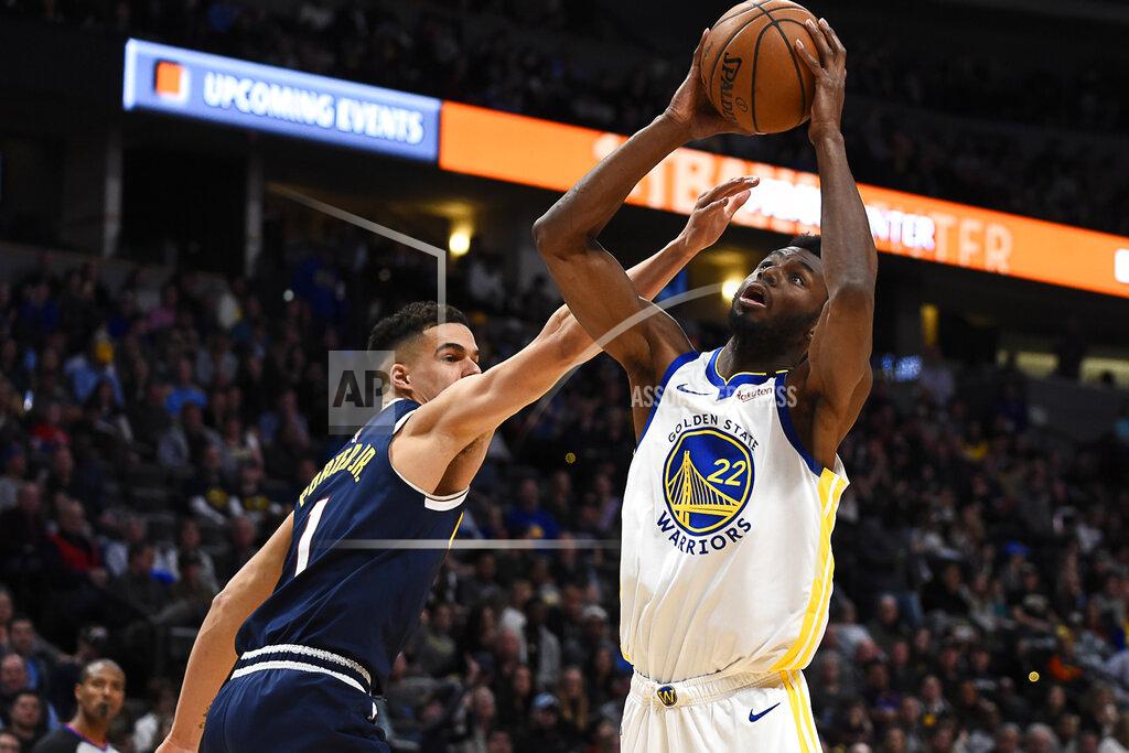 John Leyba FILE - In this March 3, 2020, file photo, Golden State Warriors guard Andrew Wiggins (22) shoots against Denver Nuggets forward Michael Porter Jr. (1) during an NBA basketball game in Denver. With Klay Thompson sidelined, Wiggins embraces a bigger load. (AP Photo/John Leyba, File)