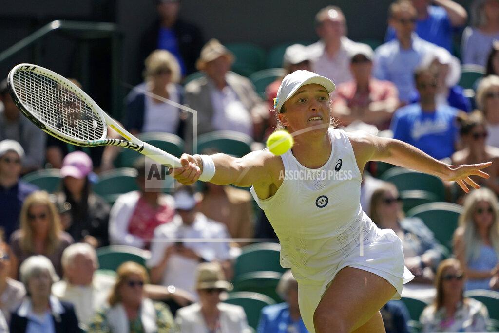 Alberto Pezzali Poland's Iga Swiatek returns to Croatia's Jana Fett in a first round women's singles match on day two of the Wimbledon tennis championships in London, Tuesday, June 28, 2022. (AP Photo/Alberto Pezzali)