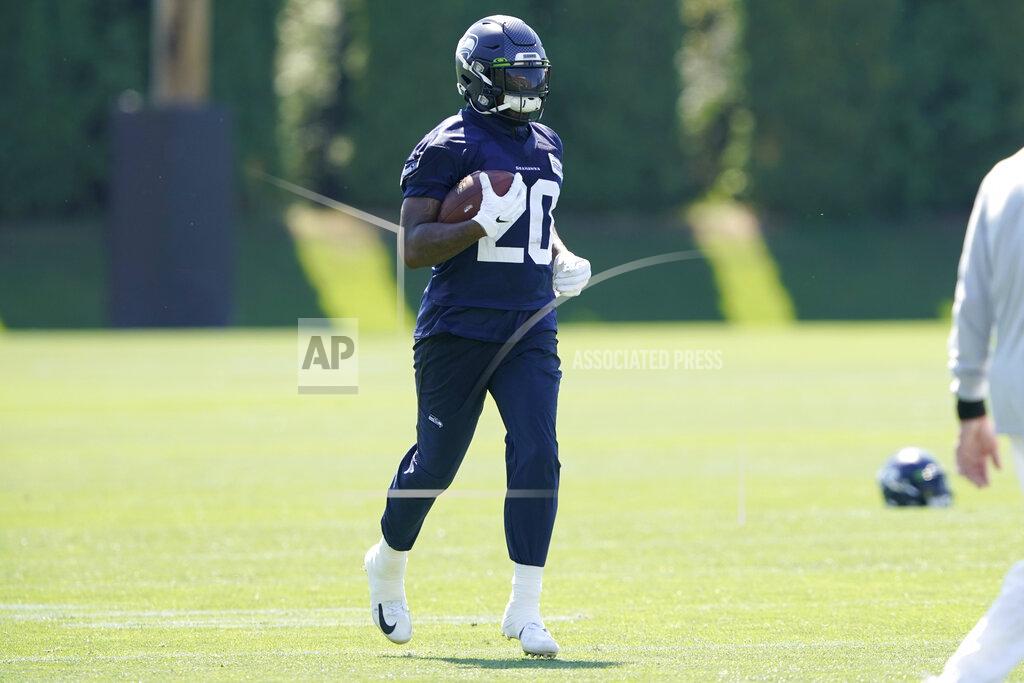 Ted S. Warren Seattle Seahawks running back Rashaad Penny carries the ball during NFL football practice Thursday, July 29, 2021, in Renton, Wash. (AP Photo/Ted S. Warren)
