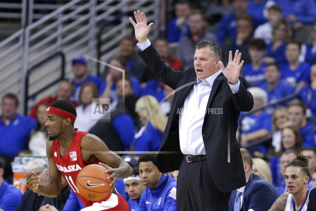 Nati Harnik Creighton coach Greg McDermott calls instructions behind Nebraska's Dachon Burke Jr. (11) during the first half of an NCAA college basketball game in Omaha, Neb., Saturday, Dec. 7, 2019. (AP Photo/Nati Harnik)