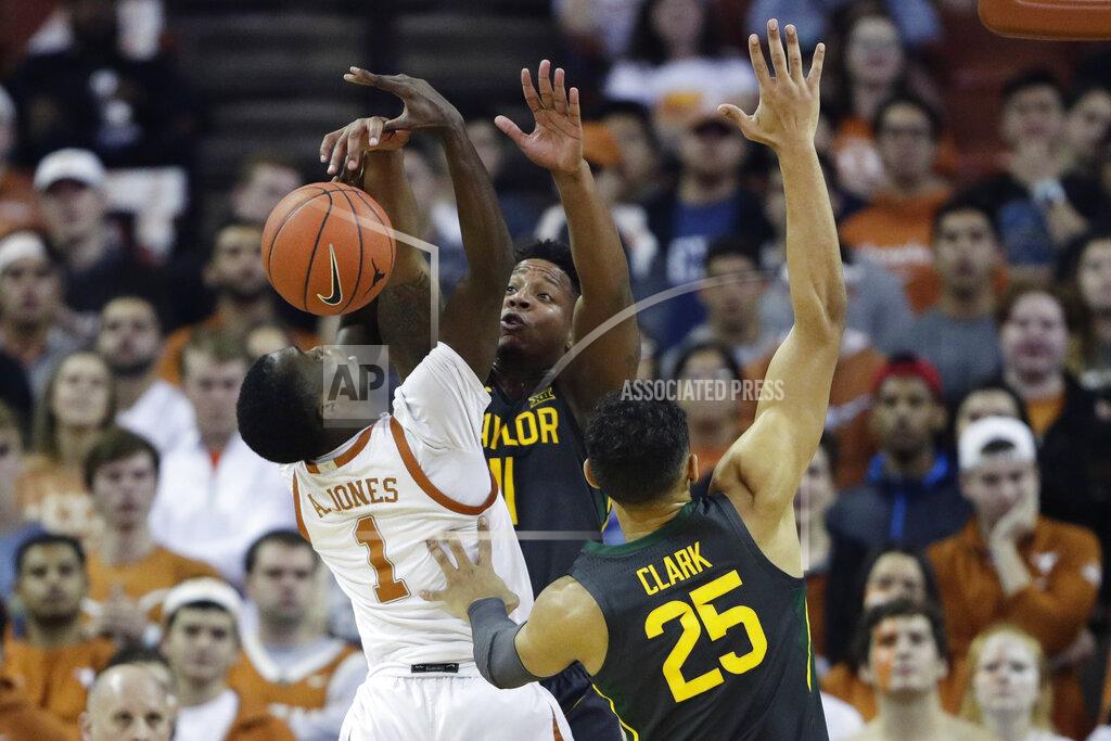 Eric Gay Texas guard Andrew Jones (1) is blocked by Baylor guard Mark Vital (11) during the first half of an NCAA college basketball game, Monday, Feb. 10, 2020, in Austin, Texas. (AP Photo/Eric Gay)