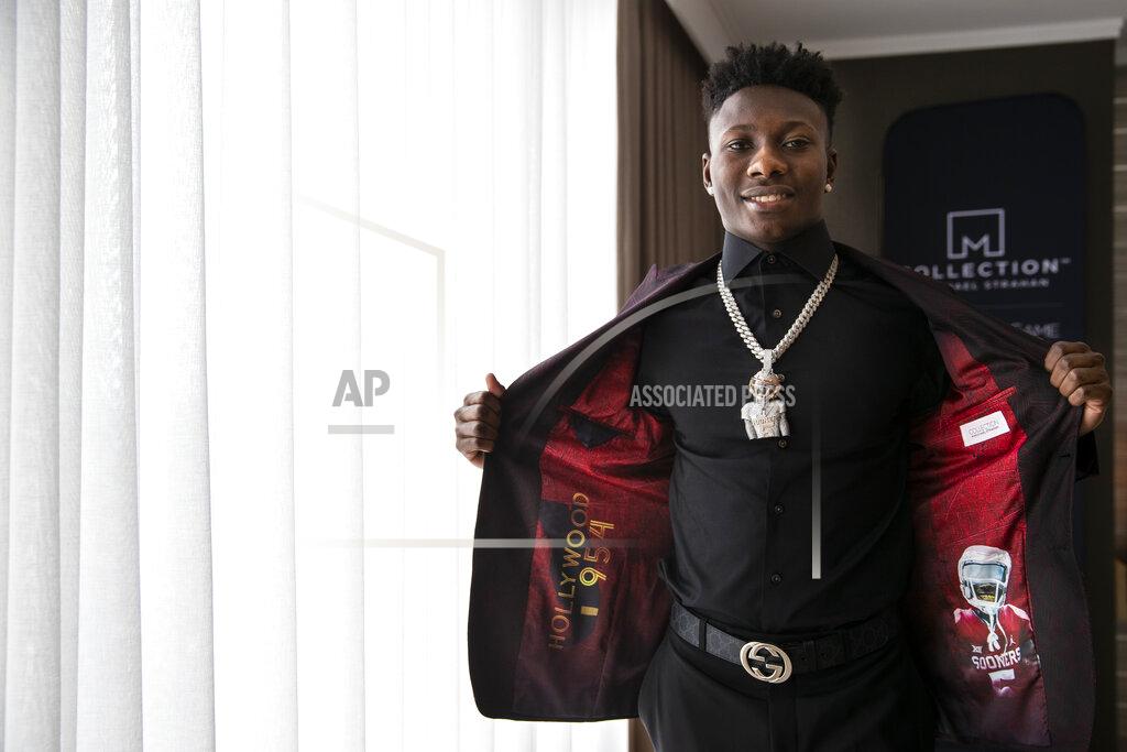 Brett Carlsen IMAGE DISTRIBUTED FOR JCPENNEY - Top NFL Draft prospect, Marquise "Hollywood" Brown, partnered with COLLECTION by Michael Strahan exclusively available at JCPenney to show off his style as he heads to the draft on Thursday, April 25, 2019 in Nashville, Tenn. Brown personalized his jacket liner to represent his nickname and hometown, "Hollywood," and his alma mater, The University of Oklahoma. (Brett Carlsen/AP Images for JCPenney)