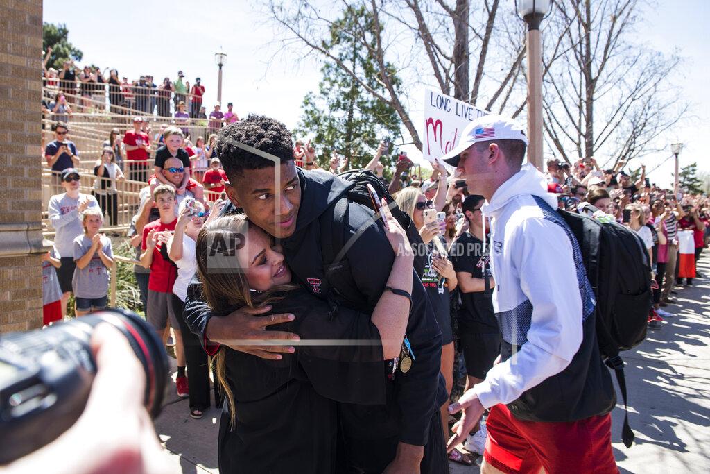 Justin Rex Texas Tech's Jarrett Culver (23) is welcomed by the crowd as he steps off the bus during a return party on Tuesday, April 9, 2019, in Lubbock, Texas. (Justin Rex/Lubbock Avalanche-Journal via AP)