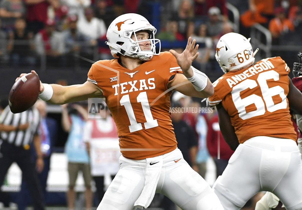 Jeffrey Mcwhorter Texas quarterback Sam Ehlinger (11) throws a pass against Oklahoma during the first half of the Big 12 Conference championship NCAA college football game on Saturday, Dec. 1, 2018, in Arlington, Texas. (AP Photo/Jeffrey McWhorter)