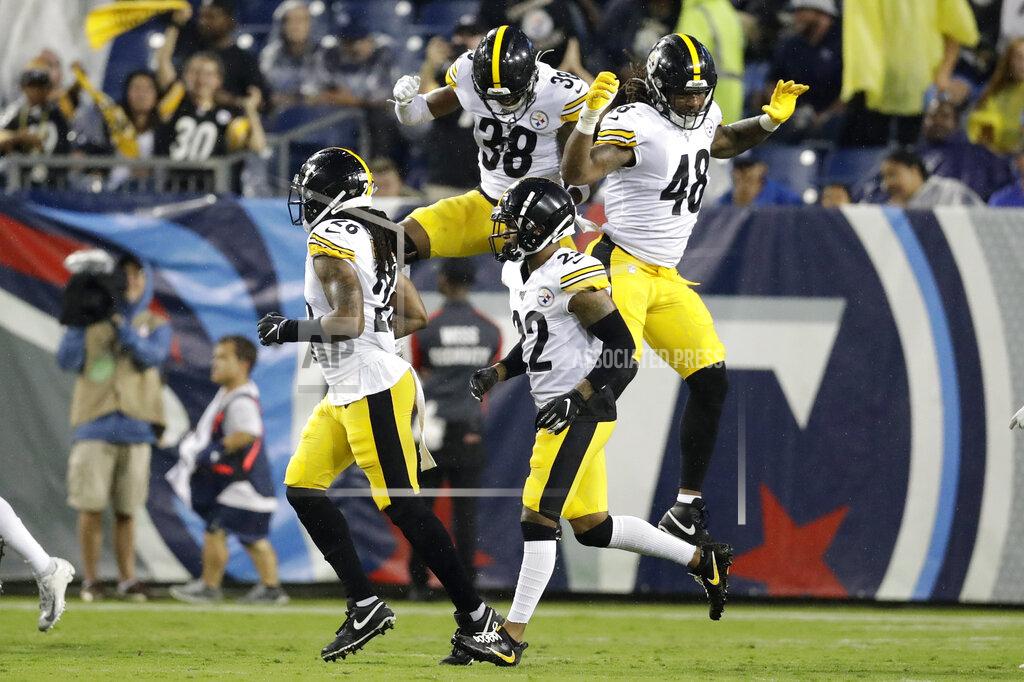 James Kenney Pittsburgh Steelers defensive back Kam Kelly (38) and outside linebacker Bud Dupree (48) celebrate after Tennessee Titans quarterback Marcus Mariota was sacked in the end zone for a safety in the first half of a preseason NFL football game Sunday, Aug. 25, 2019, in Nashville, Tenn. (AP Photo/James Kenney)