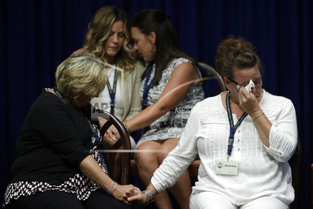 Matt Rourke FILE - In this Aug. 14, 2018 file photo, victims of clergy sexual abuse, or their family members, react as Pennsylvania Attorney General Josh Shapiro speaks during a news conference at the State Capitol in Harrisburg, Pa. Two years ago, U.S. attorney William McSwain in Philadelphia joined the long line of ambitious prosecutors investigating the Roman Catholic church's handling of priest-abuse complaints. The Justice Department had never brought a conspiracy case against the church. McSwain sent subpoenas to dioceses across Pennsylvania asking them to turn over their files and submit to grand jury testimony if asked. The dioceses pledged to comply. But as McSwain's tenure nears its end as President-elect Joe Biden takes office next month, there's no sign that any sweeping church indictment is afoot. (AP Photo/Matt Rourke, File)
