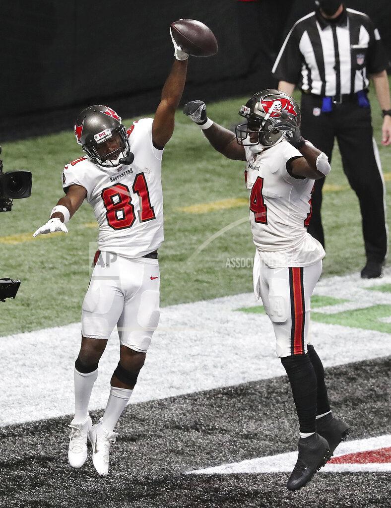 Curtis Compton Tampa Bay Buccaneers wide receiver Antonio Brown, left, celebrates his winning touchdown with Chris Godwin for a victory over the Atlanta Falcons in the final minutes of an NFL football game Sunday, Dec. 20, 2020, in Atlanta. (Curtis Compton/Atlanta Journal-Constitution via AP)