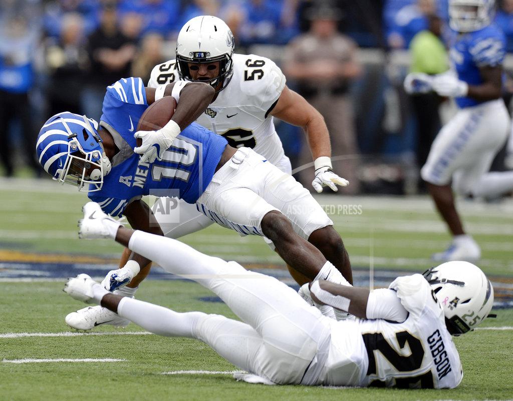 Mark Zaleski Memphis wide receiver Damonte Coxie (10) is brought down by Central Florida defensive back Kyle Gibson (25) after catching a pass during the first half of an NCAA college football game Saturday, Oct. 13, 2018, in Memphis, Tenn. (AP Photo/Mark Zaleski)