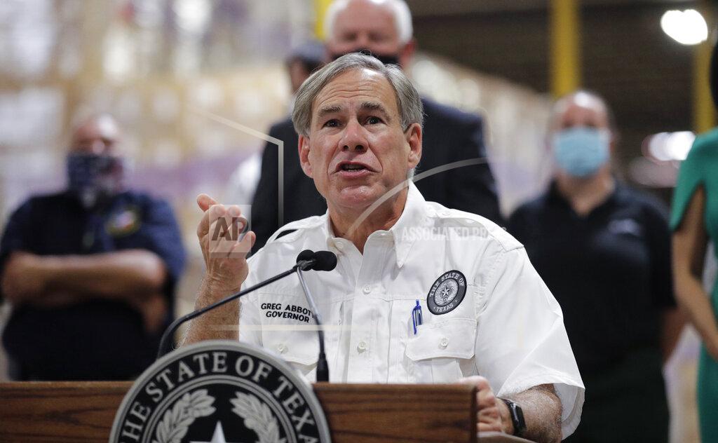 Eric Gay Texas Gov. Greg Abbott speaks to the media during a visit to a Texas Division of Emergency Management Warehouse filled with Personal Protective Equipment, Tuesday, Aug. 4, 2020, in San Antonio. (AP Photo/Eric Gay)