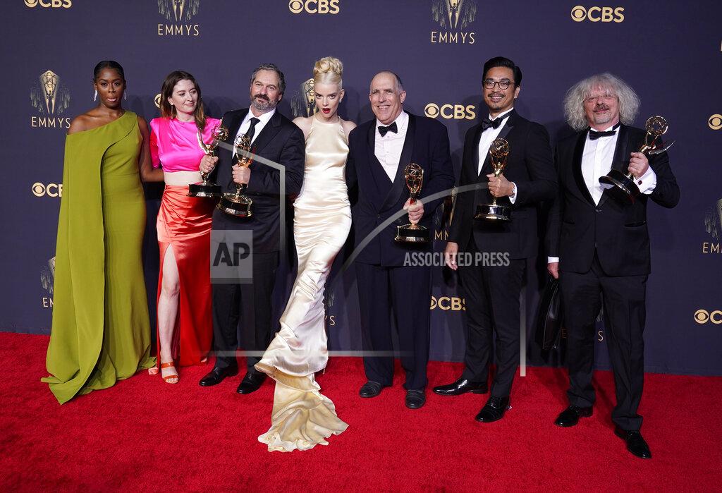 Chris Pizzello Moses Ingram, from left, Marielle Heller, Scott Frank, Anya Taylor-Joy, William Horberg, Mick Aniceto and Marcus Loges, winners of the award for outstanding directing for a limited or anthology series or movie for "The Queen's Gambit", pose at the 73rd Primetime Emmy Awards on Sunday, Sept. 19, 2021, at L.A. Live in Los Angeles. (AP Photo/Chris Pizzello)
