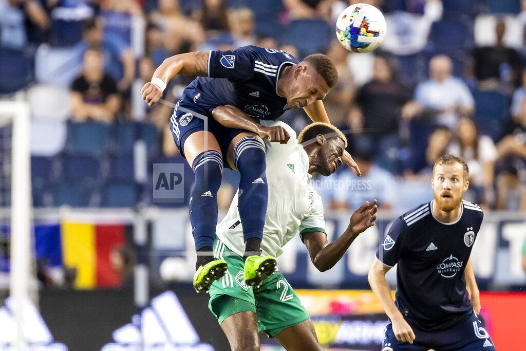Nick Tre. Smith Sporting Kansas City defender Kortne Ford (12) heads the ball over Colorado Rapids Forward Gyasi Zardes (29) during an MLS soccer game Wednesday May 18, 2022 at Children's Mercy Park in Kansas City, Kan.. (Nick Tre. Smith/The Kansas City Star via AP)