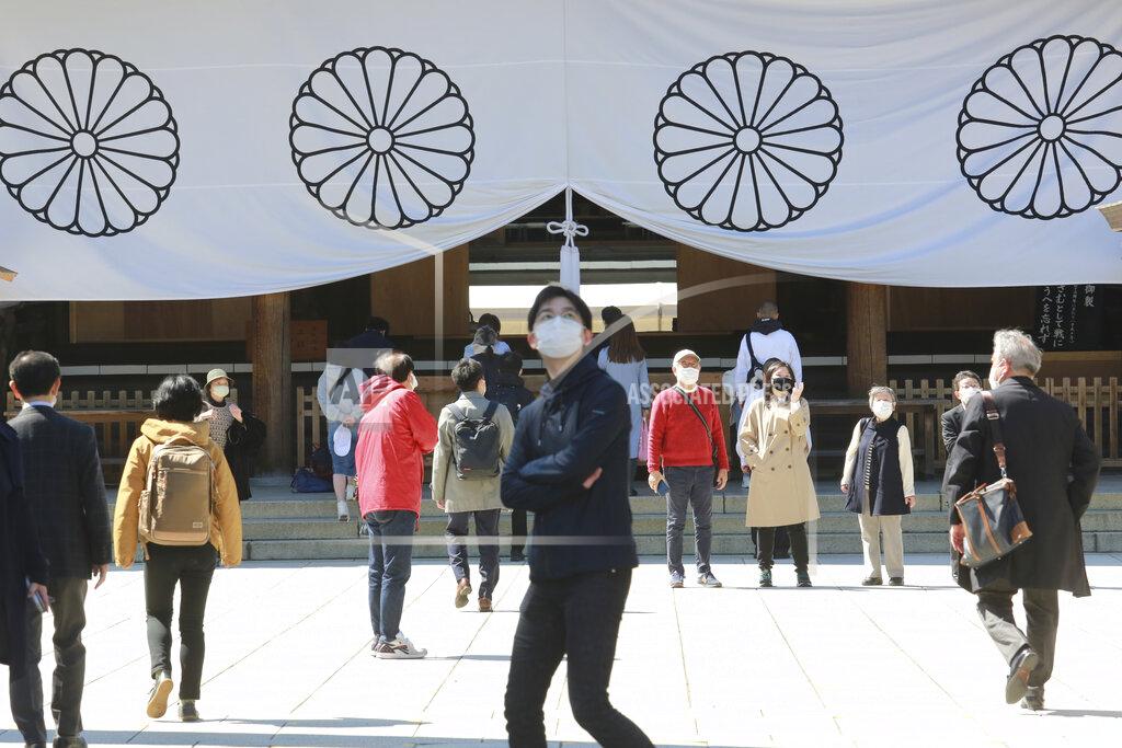 Koji Sasahara People wearing face masks to protect against the spread of the coronavirus visit at Yasukuni shrine in Tokyo, Monday, March 15, 2021. (AP Photo/Koji Sasahara)