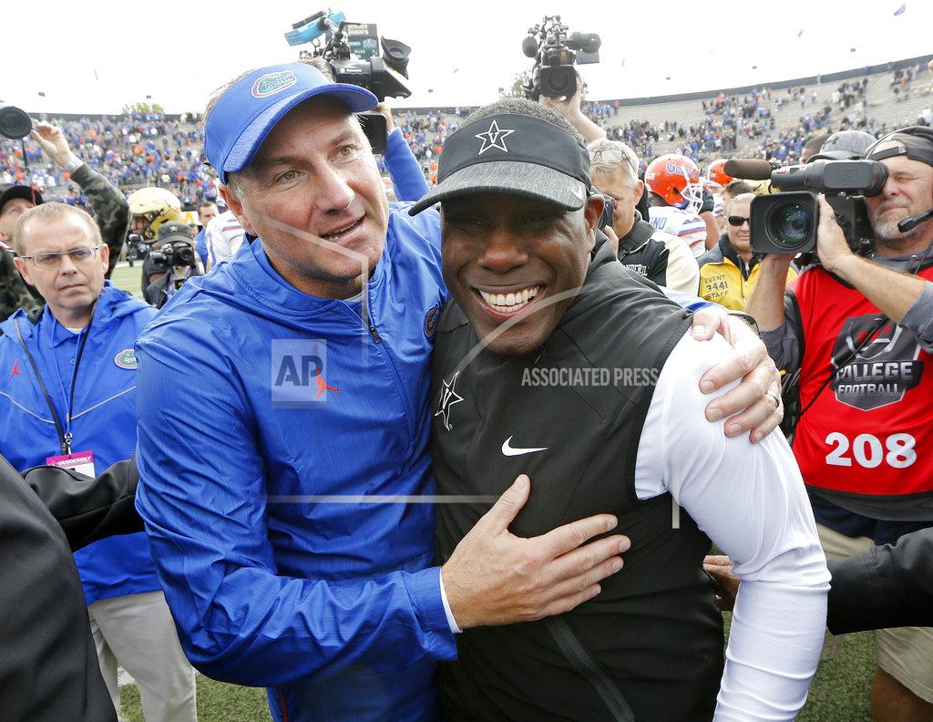 Mark Humphrey Florida head coach Dan Mullen, left, and Vanderbilt head coach Derek Mason meet on the field after an NCAA college football game Saturday, Oct. 13, 2018, in Nashville, Tenn. Florida won 37-27. (AP Photo/Mark Humphrey)