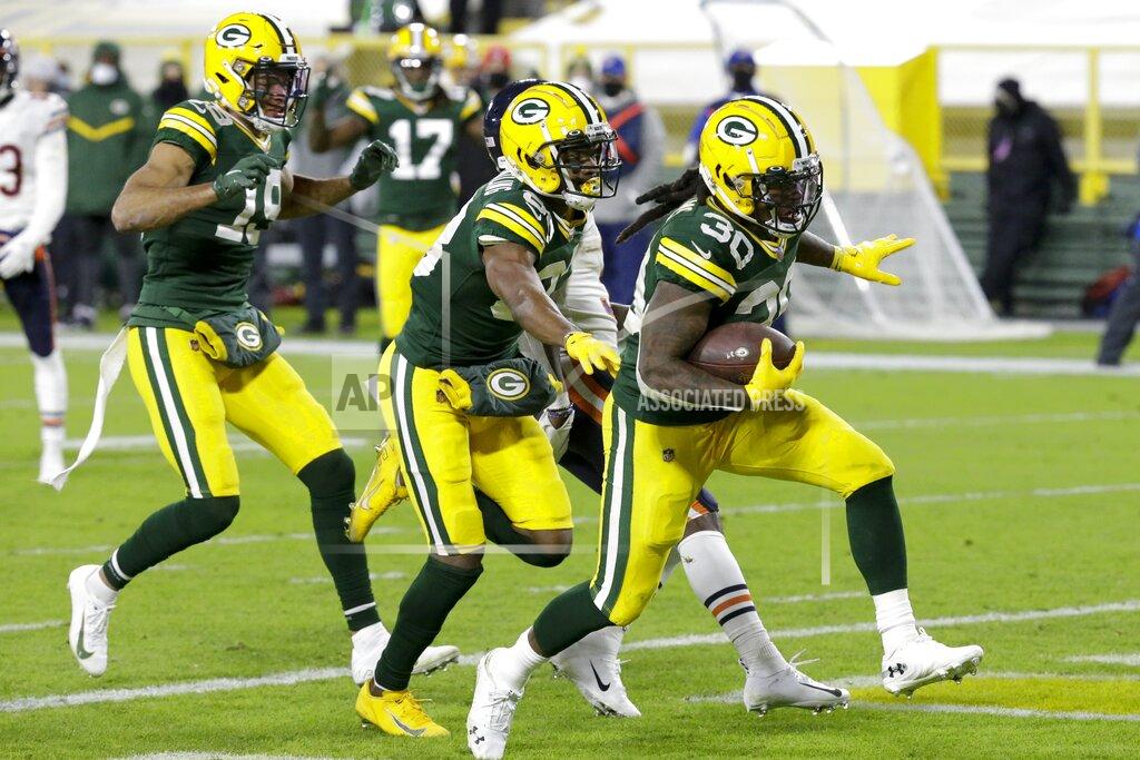 Mike Roemer Green Bay Packers' Jamaal Williams runs for a rtouchdown during the second half of an NFL football game against the Chicago Bears Sunday, Nov. 29, 2020, in Green Bay, Wis. (AP Photo/Mike Roemer)