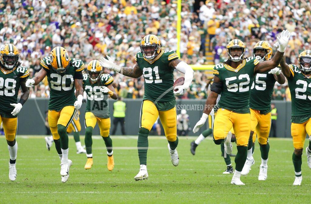 Morry Gash Green Bay Packers' Preston Smith celebrates his interception with teammates during the first half of an NFL football game against the Minnesota Vikings Sunday, Sept. 15, 2019, in Green Bay, Wis. (AP Photo/Morry Gash)