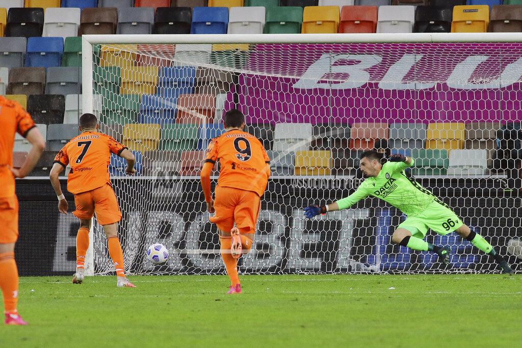 Andrea Bressanutti Juventus' Cristiano Ronaldo scores his team's first goal on a penalty kick during the Italian Serie A soccer match between Udinese and Juventus at the Dacia Arena stadium in Udine, Italy, Sunday, May 2, 2021. (Andrea Bressanutti/LaPresse via AP)