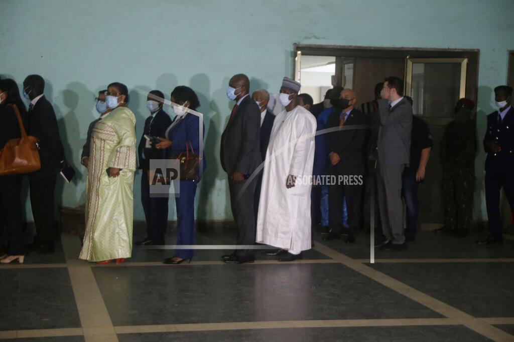 Sunday Alamba Ambassadors and foreign representations, wait for a meeting with Military junta led by Col. Mamady Doumbouya, at the people's palace in Conakry, Guinea Wednesday, Sept. 15, 2021. Guinea's junta is expected to face more pressure to set a timeframe for new elections Tuesday as the military rulers open a four-day series of meetings about the West African nation's future following the president's overthrow in a coup just over a week ago. (AP Photo/Sunday Alamba)