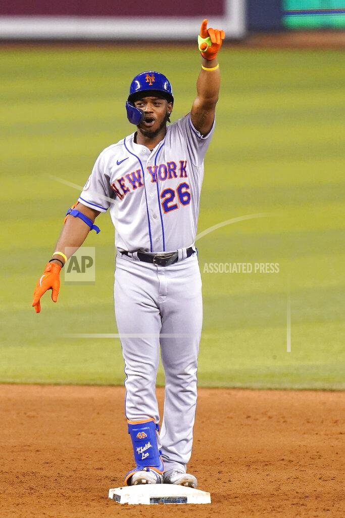 Lynne Sladky New York Mets' Khalil Lee gestures after hitting a double to score Dominic Smith during the 12th inning of the team's baseball game against the Miami Marlins, Friday, May 21, 2021, in Miami. The Mets won 6-5 in 12 innings. (AP Photo/Lynne Sladky)