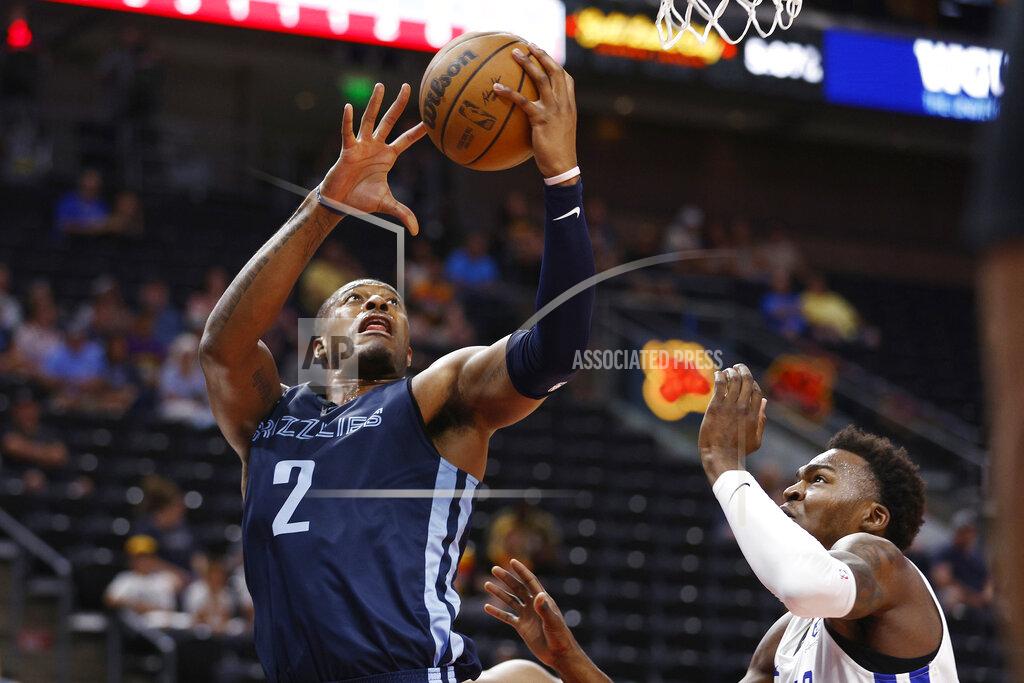 Jeff Swinger Memphis Grizzlies center Xavier Tillman (2) shoots against Philadelphia 76ers forward Paul Reed Jr. during the first quarter of an NBA summer league basketball game Tuesday, July 5, 2022, in Salt Lake City. (AP Photo/Jeff Swinger)