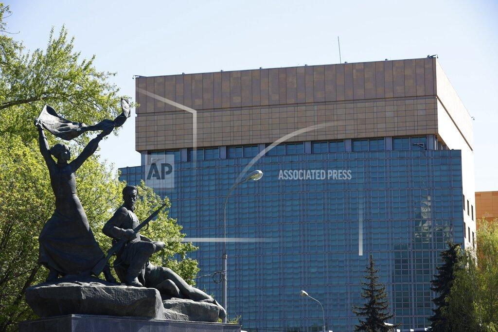 Alexander Zemlianichenko The U.S. Embassy is seen behind a monument to the Revolution workers of 1905 Revolution in Moscow, Russia, Tuesday, May 11, 2021. Under Kremlin orders, the U.S. Embassy has stopped employing Russians, leaving Russian businessmen, lovers and exchange students adrift because they can't get visas and American parents unable to register their newborns as citizens. (AP Photo/Alexander Zemlianichenko)