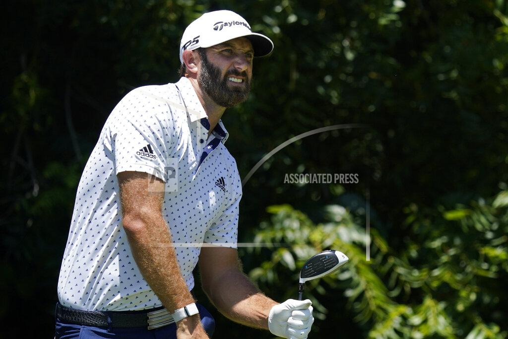 David J. Phillip Dustin Johnson watches his tee shot on the sixth hole during the second round of the Charles Schwab Challenge golf tournament at the Colonial Country Club in Fort Worth, Texas, Friday, June 12, 2020. (AP Photo/David J. Phillip)