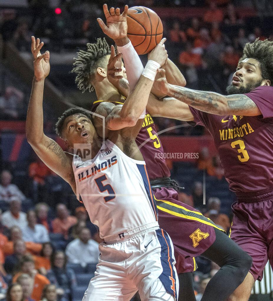 Rick Danzl Illinois guard Tevian Jones, left, and Minnesota guard Amir Coffey and forward Jordan Murphy (3) go after a rebound during the first half of an NCAA college basketball game in Champaign, Ill., Wednesday, Jan. 16, 2019. (AP Photo/Rick Danzl)