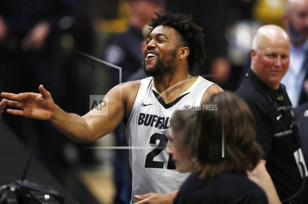 David Zalubowski Colorado Buffaloes forward Evan Battey celebrates with fans after the second half of an NCAA college basketball game against USC Saturday, March 9, 2019, in Boulder, Colo. Colorado won 78-67. (AP Photo/David Zalubowski)