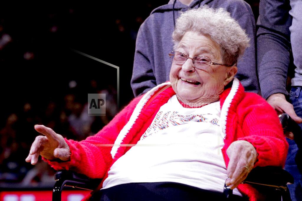 Nati Harnik 98-year-old Florence Dalby smiles at halftime of an NCAA college basketball game between Ohio State and Nebraska in Lincoln, Neb., Saturday, Jan. 26, 2019. Dalby is a University of Nebraska Lincoln graduate and has had a men's basketball season ticket for more than 80 years. Dalby loves Nebraska as much today as she did when she first started going to games in 1939. The Cornhuskers honored her during their Coaches Vs. Cancer game against Ohio State. (AP Photo/Nati Harnik)