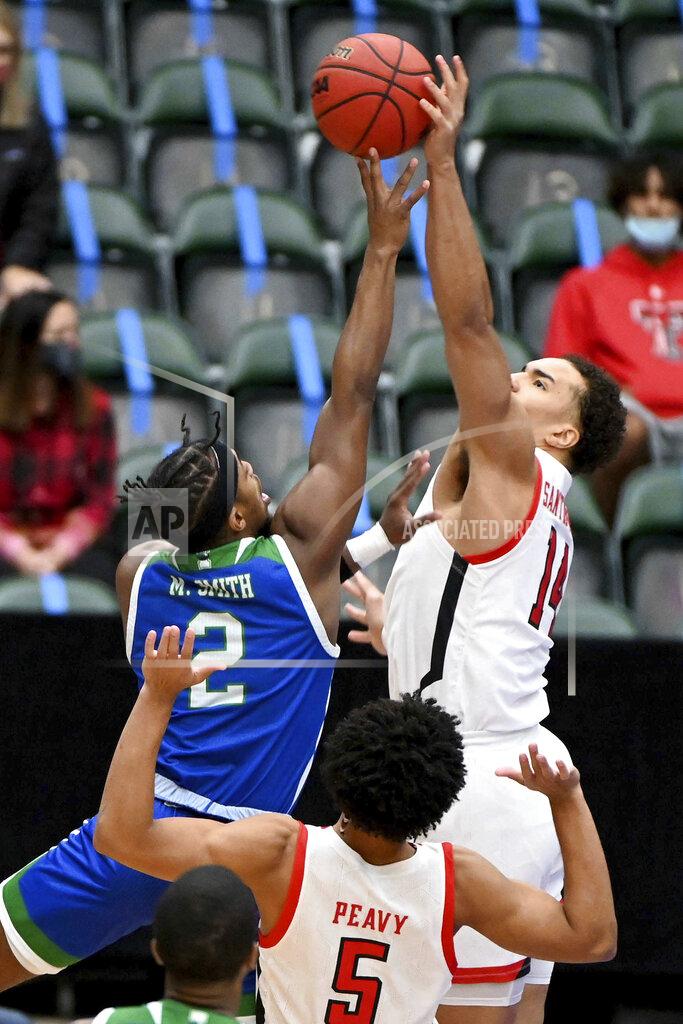 Matt Strasen Texas Tech Red forward Marcus Santos-Silva (14) blocks a shot by Texas A&M-CC guard Myles Smith (2) in the first half of an NCAA college basketball game in Frisco, Texas, Saturday, Dec. 12, 2020. (AP Photo/Matt Strasen)