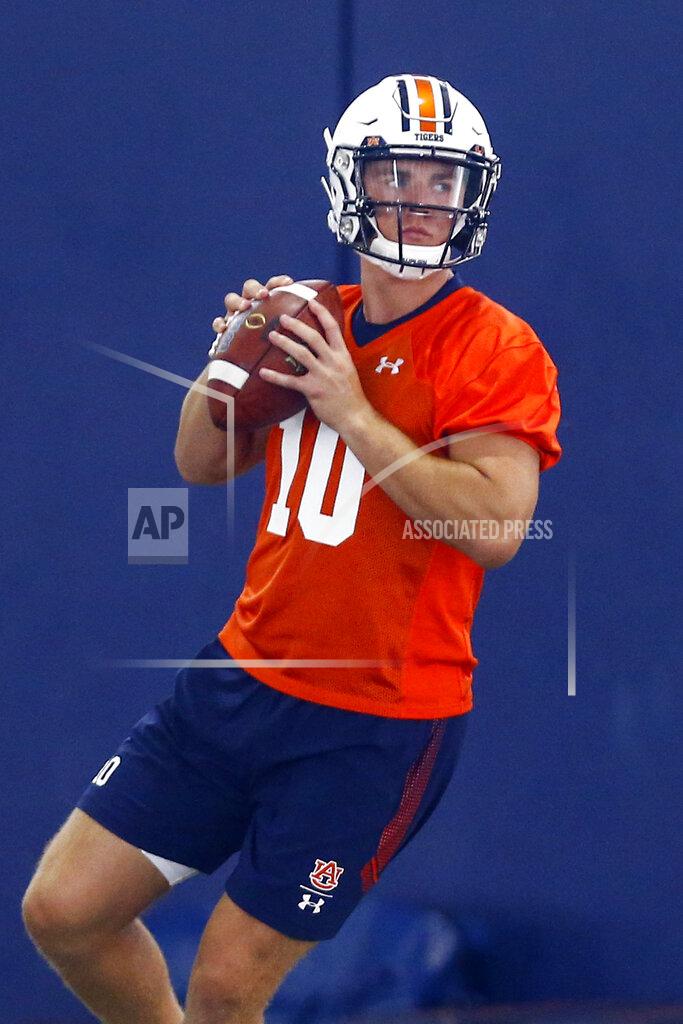 FILE - In this Friday, Aug. 2, 2019 file photo, Auburn quarterback Bo Nix throws a pass during Auburn's first practice in Auburn, Ala. Freshman Bo Nix will be Auburn’s starting quarterback in the season opener against Oregon. Auburn announced coach Gus Malzahn’s decision on Twitter, officially ending a battle with redshirt freshman Joey Gatewood, Tuesday, Aug. 20, 2019. (AP Photo/Butch Dill)