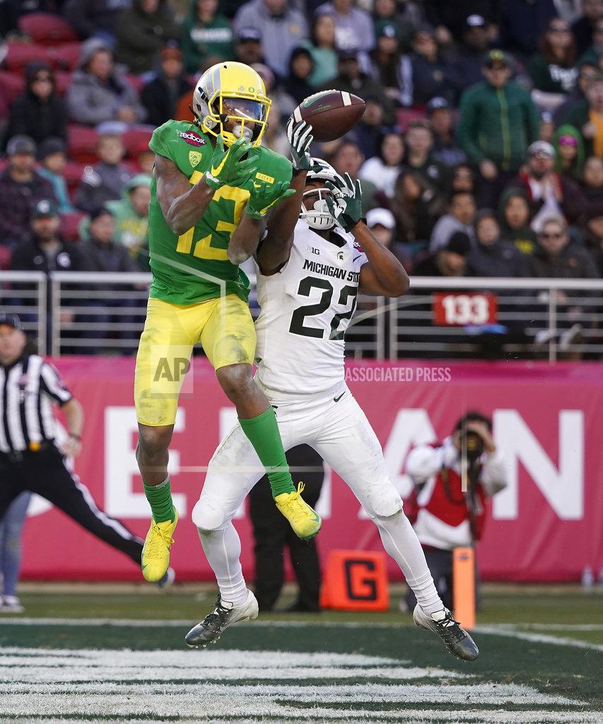 Tony Avelar Michigan State cornerback Josiah Scott (22) breaks up a pass for Oregon wide receiver Dillon Mitchell (13) during the second half of the Redbox Bowl NCAA college football game Monday, Dec. 31, 2018, in Santa Clara, Calif. Oregon won 7-6. (AP Photo/Tony Avelar)