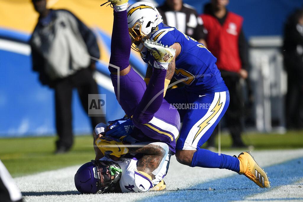 Kelvin Kuo Minnesota Vikings tight end Irv Smith holds on to the pass for a touchdown as Los Angeles Chargers free safety Derwin James defends during the first half of an NFL football game Sunday, Dec. 15, 2019, in Carson, Calif. (AP Photo/Kelvin Kuo)