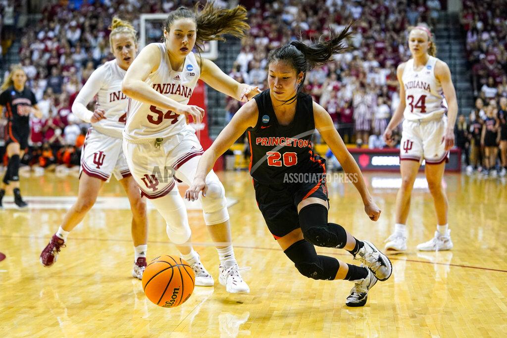 Michael Conroy Princeton guard Kaitlyn Chen (20) chases down a loose ball in front of Indiana forward Mackenzie Holmes (54) in the first half of a college basketball game in the second round of the NCAA tournament in Bloomington, Ind., Monday, March 21, 2022. (AP Photo/Michael Conroy)