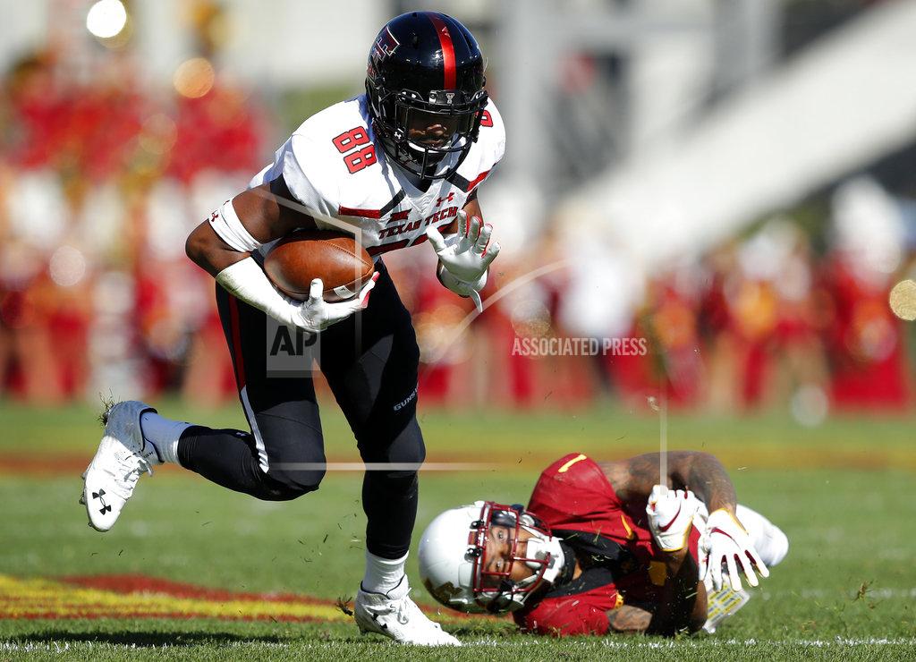 Charlie Neibergall Texas Tech wide receiver Ja'Deion High (88) breaks a tackle by Iowa State defensive back D'Andre Payne, right, after making a reception during the first half of an NCAA college football game, Saturday, Oct. 27, 2018, in Ames, Iowa. (AP Photo/Charlie Neibergall)