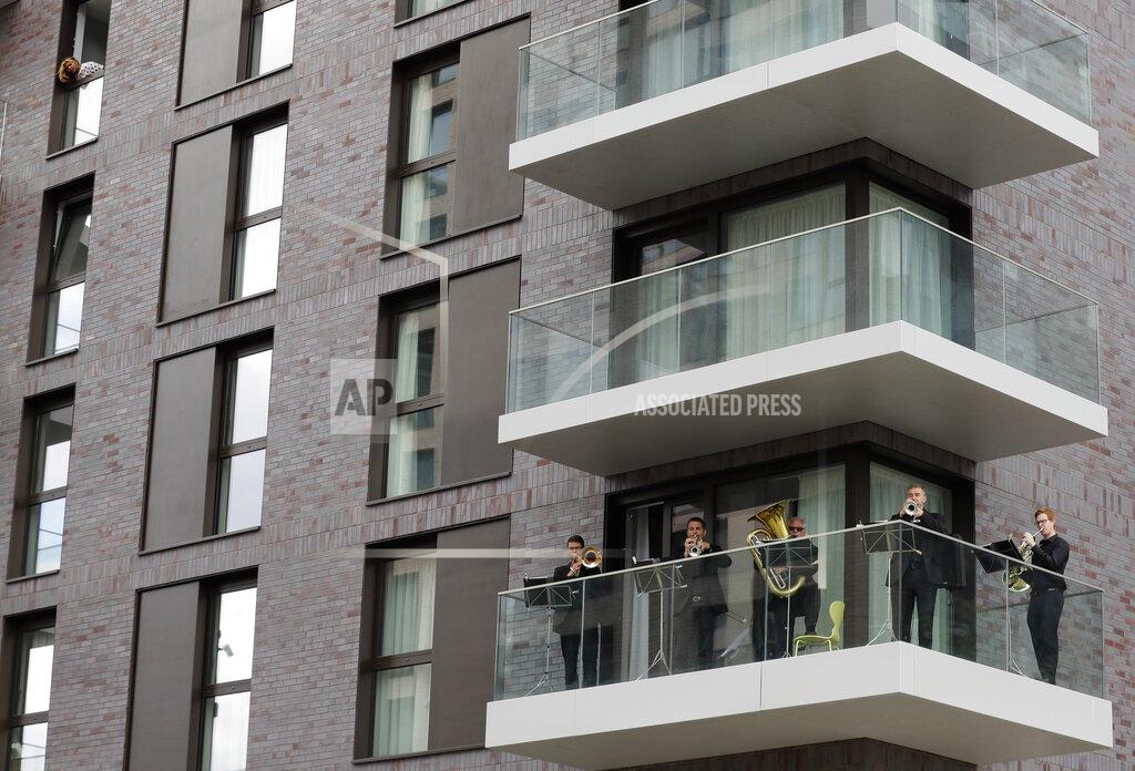 Kirsty Wigglesworth FILE - Musicians with the Royal Philharmonic Orchestra play from a balcony at Wembley Park in London, Saturday, Sept. 5, 2020. The Royal Philharmonic Orchestra's first public appearance since the lockdown from the pandemic. (AP Photo/Kirsty Wigglesworth, File)