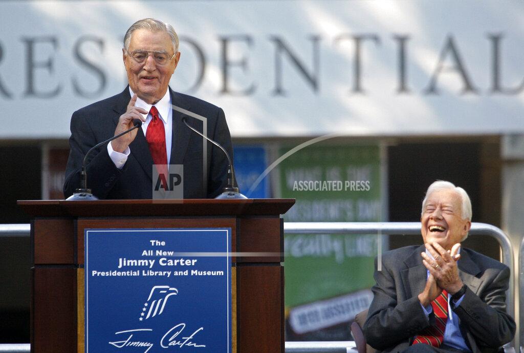 John Bazemore FILE - In this Thursday, Oct. 1, 2009, file photo, former President Jimmy Carter, right, laughs, as his former Vice President Walter Mondale speaks during a reopening ceremony for the newly resigned Carter Presidential Library in Atlanta. Carter was also celebrating his 85th birthday. Mondale, a liberal icon who lost the most lopsided presidential election after bluntly telling voters to expect a tax increase if he won, died Monday, April 19, 2021. He was 93. (AP Photo/John Bazemore, File)