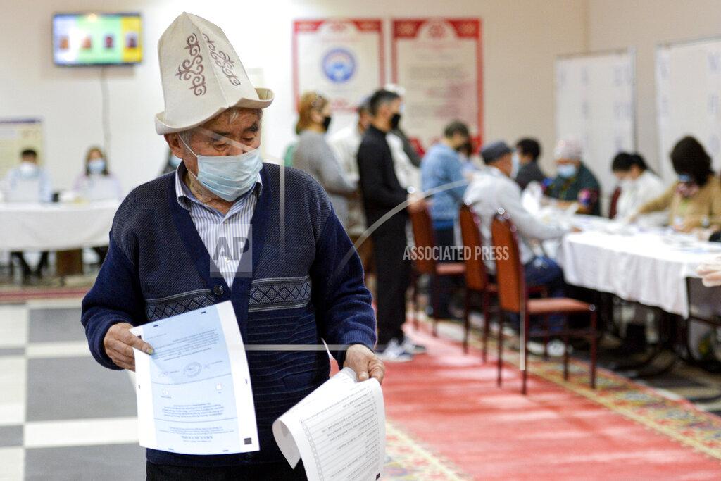 Vladimir Voronin A man in a Kyrgyz national hat casts his ballot at a polling station during the referendum in Bishkek, Kyrgyzstan, Sunday, April 11, 2021. Voters in Kyrgyzstan cast ballots Sunday on whether to approve a new constitution that would substantially increase the president's powers. The Sunday referendum comes three months after Sadyr Zhaparov was elected president, following the ouster of the previous president amid protests, the third time in 15 years that a leader of the Central Asian country had been driven from office in a popular uprising. (AP Photo/Vladimir Voronin)