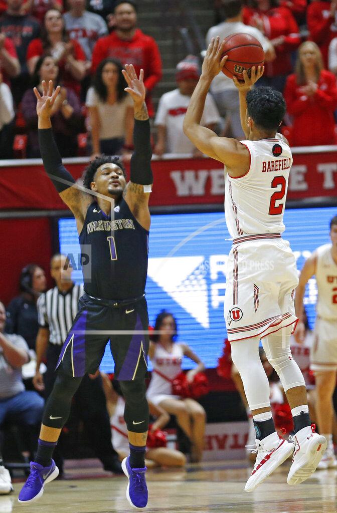Rick Bowmer Utah guard Sedrick Barefield (2) shoots as Washington guard David Crisp (1) defends during the first half of an NCAA college basketball game Thursday, Jan., 10, 2019, in Salt Lake City. (AP Photo/Rick Bowmer)