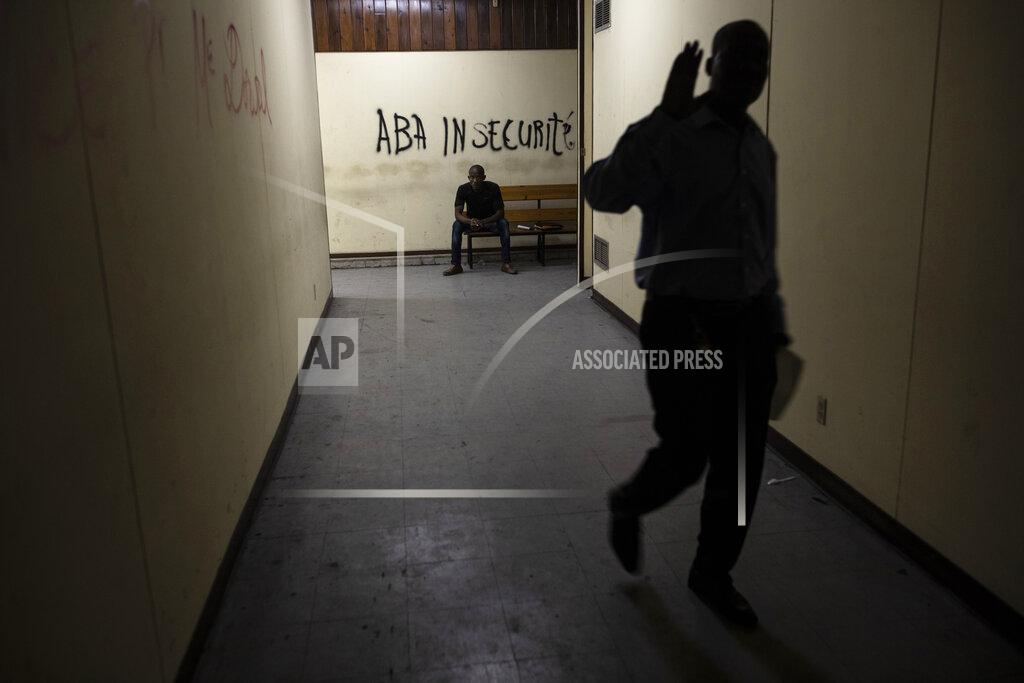 Rodrigo Abd A wall inside the Palace of Justice is spray-painted with a message that reads in Creole; "Down with insecurity", in Port-au-Prince, Haiti, Thursday, Sept. 16, 2021. Even before the assassination of President Jovenel Moise in July, the government was weak -- the Palace of Justice inactive, congress disbanded by Moise and the legislative building pocked by bullets. (AP Photo/Rodrigo Abd)