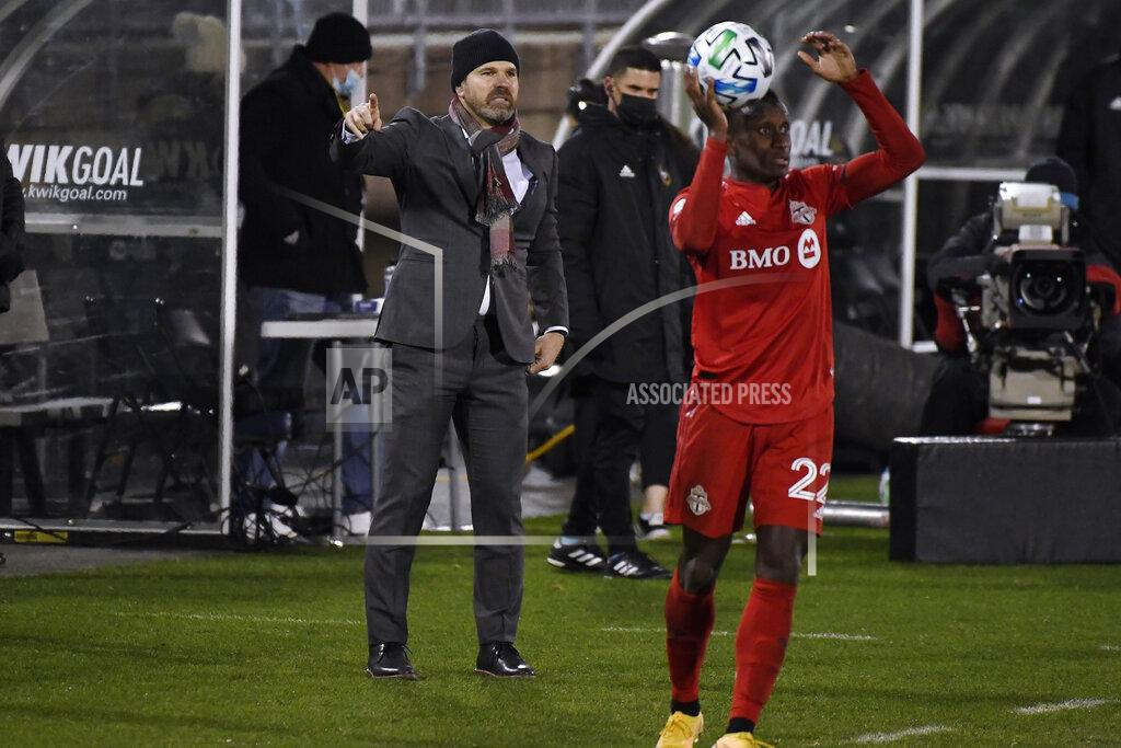 Jessica Hill Toronto FC head coach Greg Vanney, left, calls out to his team during the first half of an MLS soccer playoff match against Nashville SC, Tuesday, Nov. 24, 2020, in East Hartford, Conn. (AP Photo/Jessica Hill)