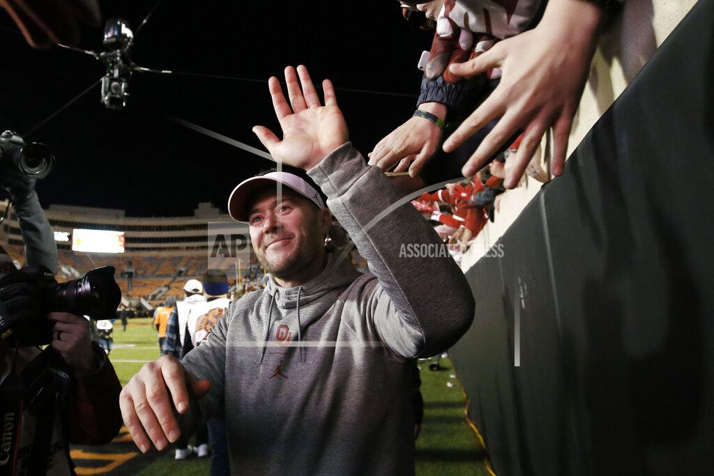 Sue Ogrocki Oklahoma head coach Lincoln Riley celebrates with fans following an NCAA college football game against Oklahoma State in Stillwater, Okla., Saturday, Nov. 30, 2019. Oklahoma won 34-16. (AP Photo/Sue Ogrocki)