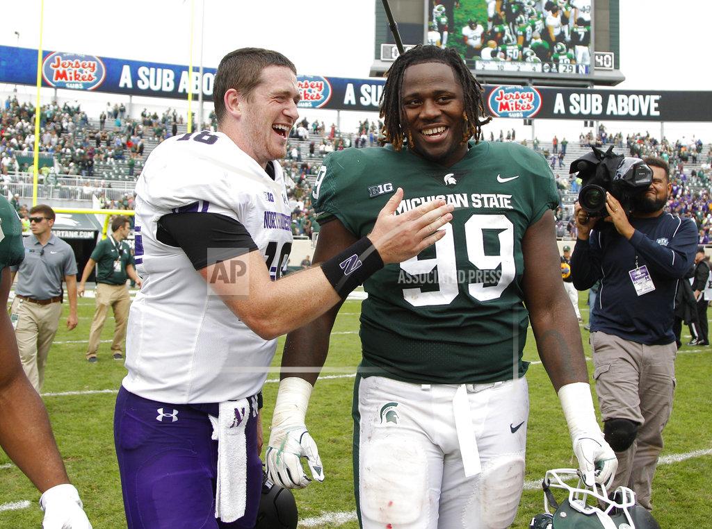 Al Goldis Northwestern quarterback Clayton Thorson, left, and Michigan State defensive tackle Raequan Williams talk following an NCAA college football game, Saturday, Oct. 6, 2018, in East Lansing, Mich. Northwestern won 29-19. (AP Photo/Al Goldis)