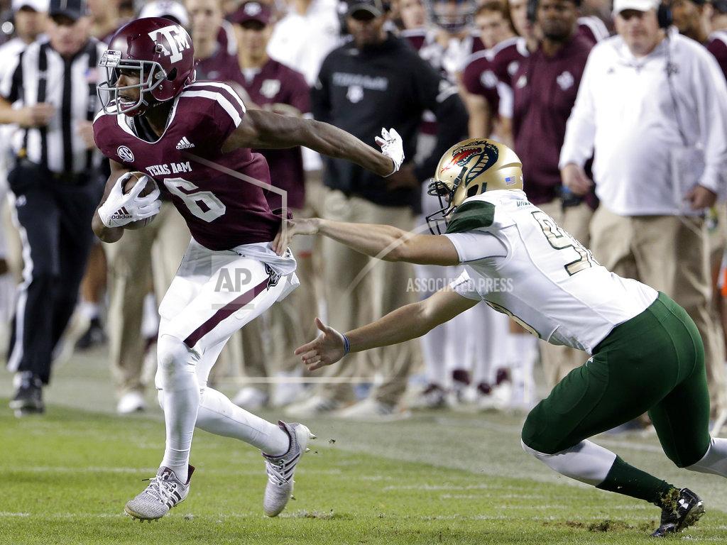 Michael Wyke Texas A&M wide receiver Roshauud Paul (6) breaks the tackle attempt by UAB defensive lineman Tyrus Butler, right, during the first half of an NCAA college football game Saturday, Nov. 17, 2018, in College Station, Texas. (AP Photo/Michael Wyke)