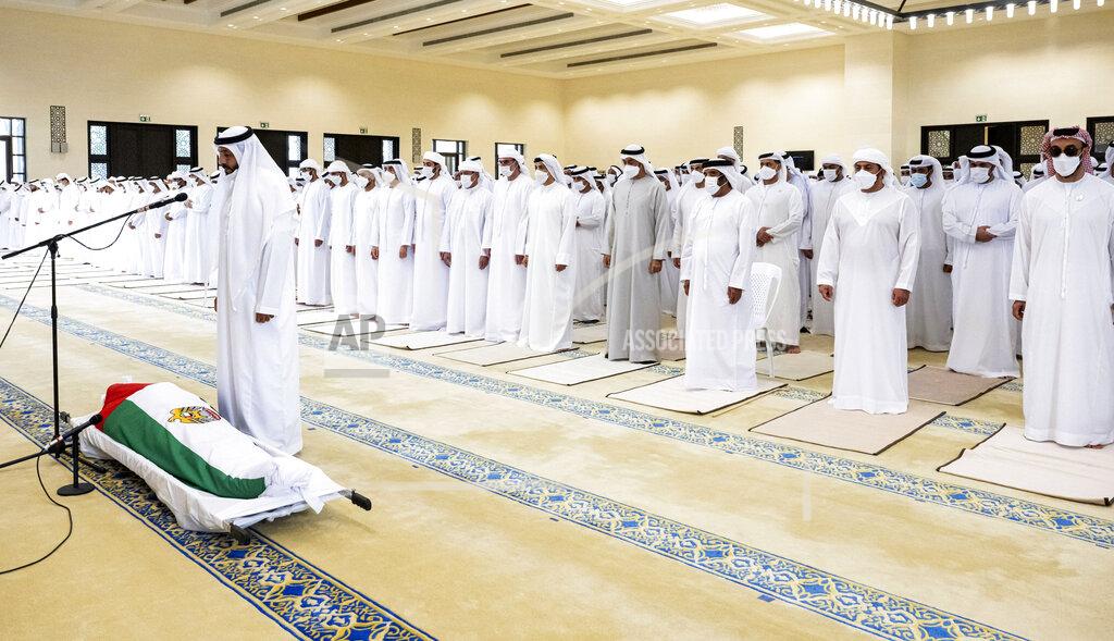 Hamad Al Kaabi This photo made available by the Ministry of Presidential Affairs, shows from right to left, Sheikh Tahnoon bin Zayed Al Nahyan UAE National Security Advisor, Sheikh Hamdan bin Zayed Al Nahyan, Ruler's Representative in Al Dhafra Region, Sheikh Saif bin Mohamed Al Nahyan, Sheikh Mohamed bin Zayed Al Nahyan, Ruler of Abu Dhabi, Sheikh Mansour bin Zayed Al Nahyan, UAE Deputy Prime Minister and Minister of Presidential Affairs and Sheikh Mohamed bin Khalifa Al Nahyan, Abu Dhabi Executive Council Member, attend the funeral prayers for UAE president Sheikh Khalifa bin Zayed Al Nahyan, at Sheikh Sultan bin Zayed The First mosque, Friday, May 13, 2022. (Hamad Al Kaabi/Ministry of Presidential Affairs via AP)